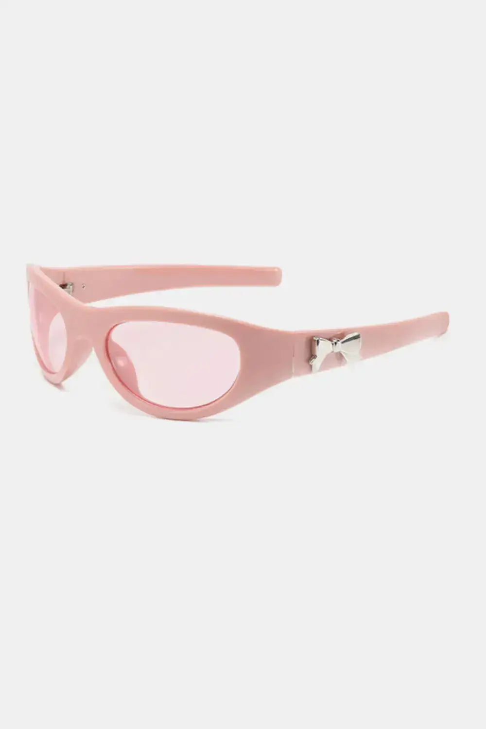 Polycarbonate Frame Cat-Eye Sunglasses in pink with bow detail and UV protection.