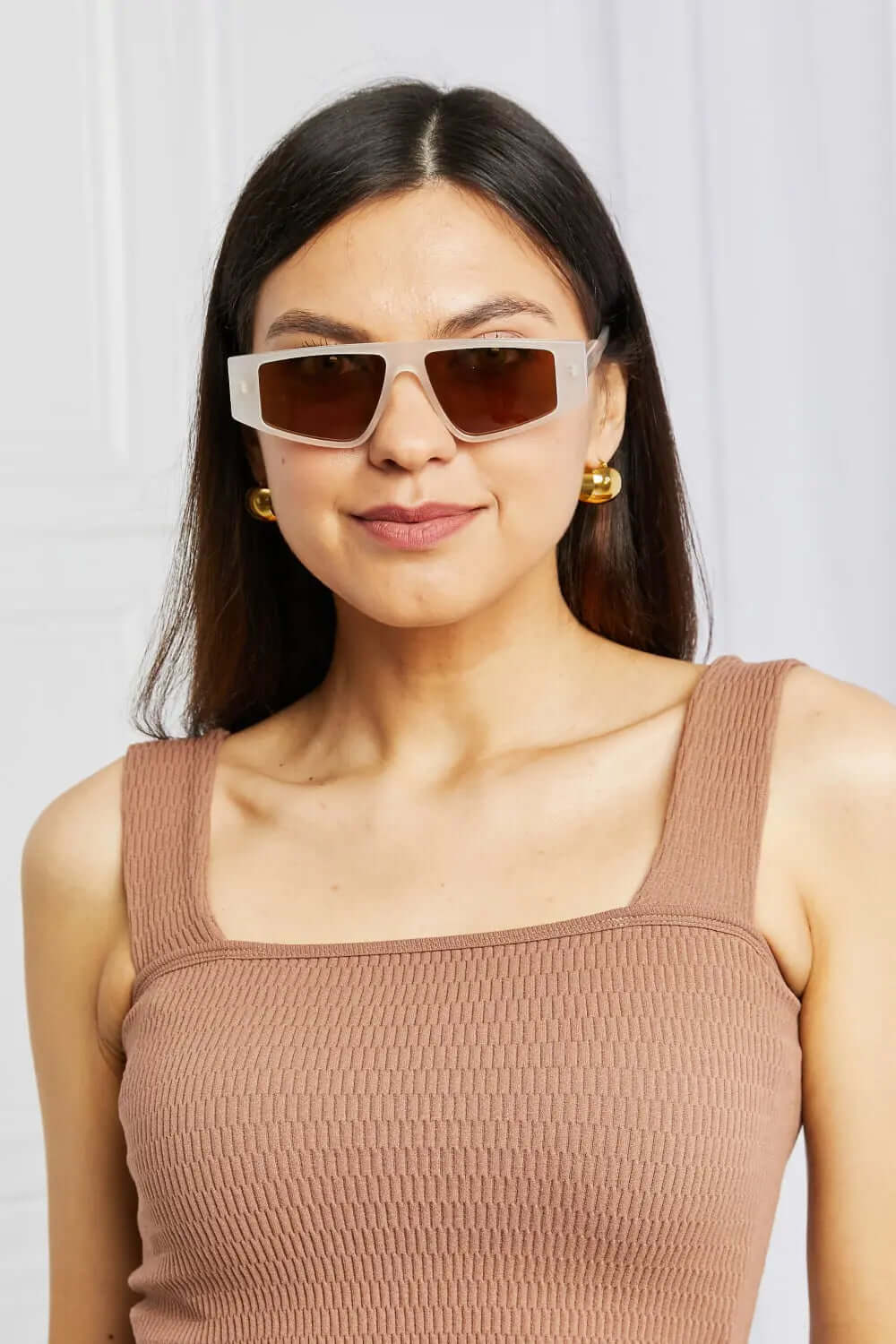 Geometric TAC Polarization Lens Sunglasses worn by a model with earrings, showcasing stylish design and UV protection.