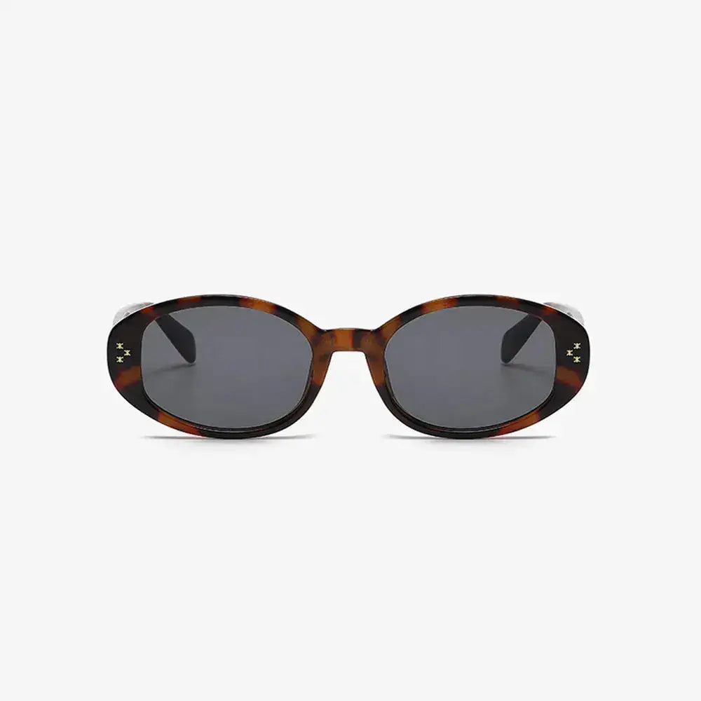 Polycarbonate Frame Oval Sunglasses with UV protection in tortoiseshell pattern.