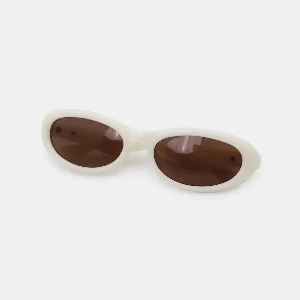 Polycarbonate Frame Cat Eye Sunglasses with brown lenses and white frame showcasing stylish design.