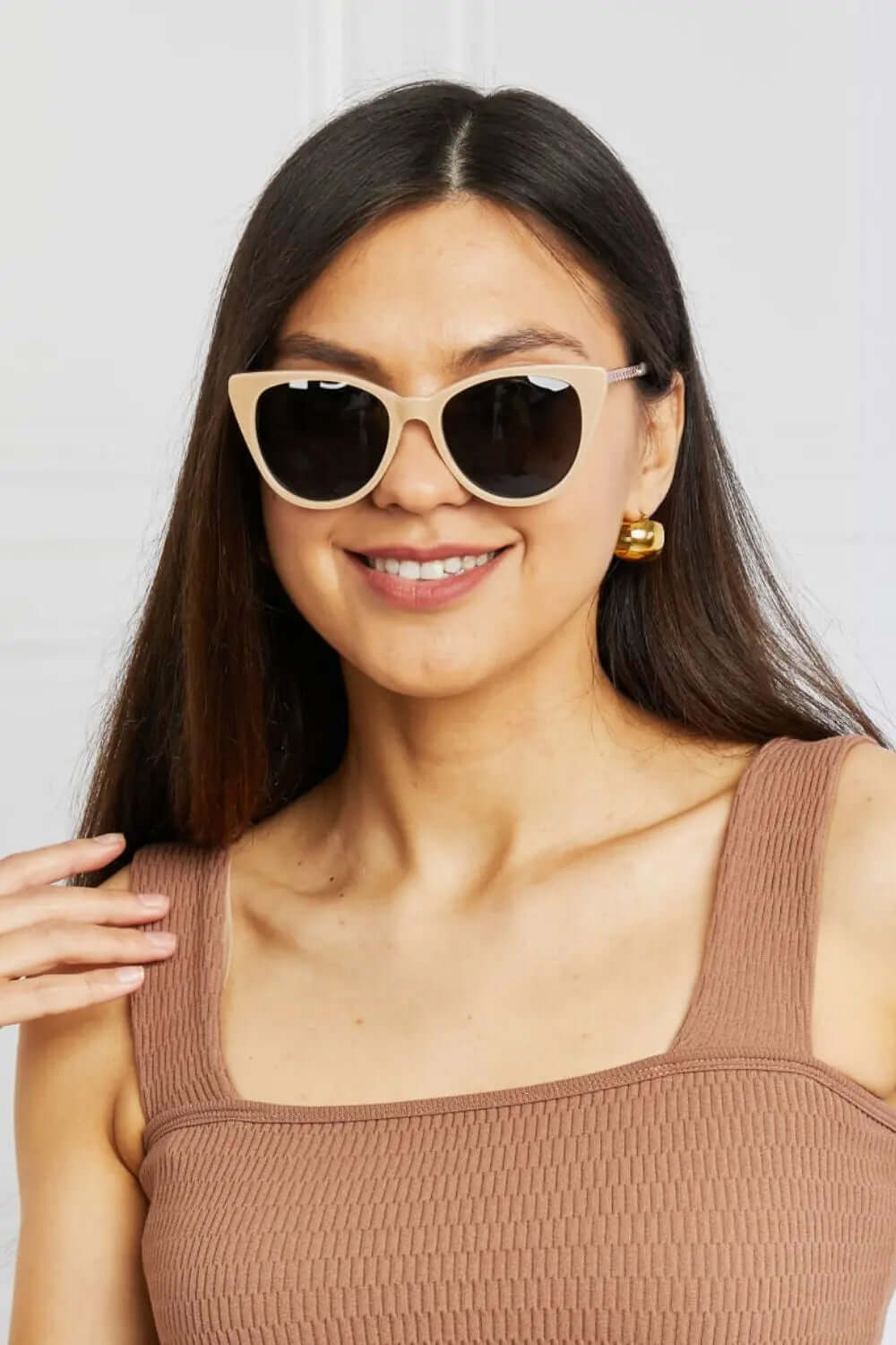 Cat-Eye Acetate Frame Sunglasses worn by a woman, featuring a stylish cat-eye shape and UV400 lenses.