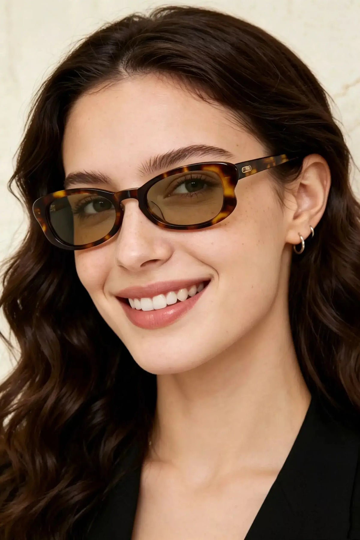 UV Protection Tortoiseshell Frame Sunglasses worn by a smiling woman with wavy hair, showcasing stylish eyewear.
