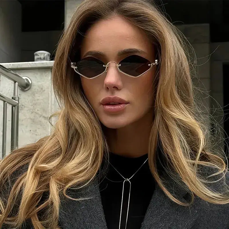 Woman wearing Cat Eye Sunglasses with Gold Metal Frame, showcasing a stylish and modern look.