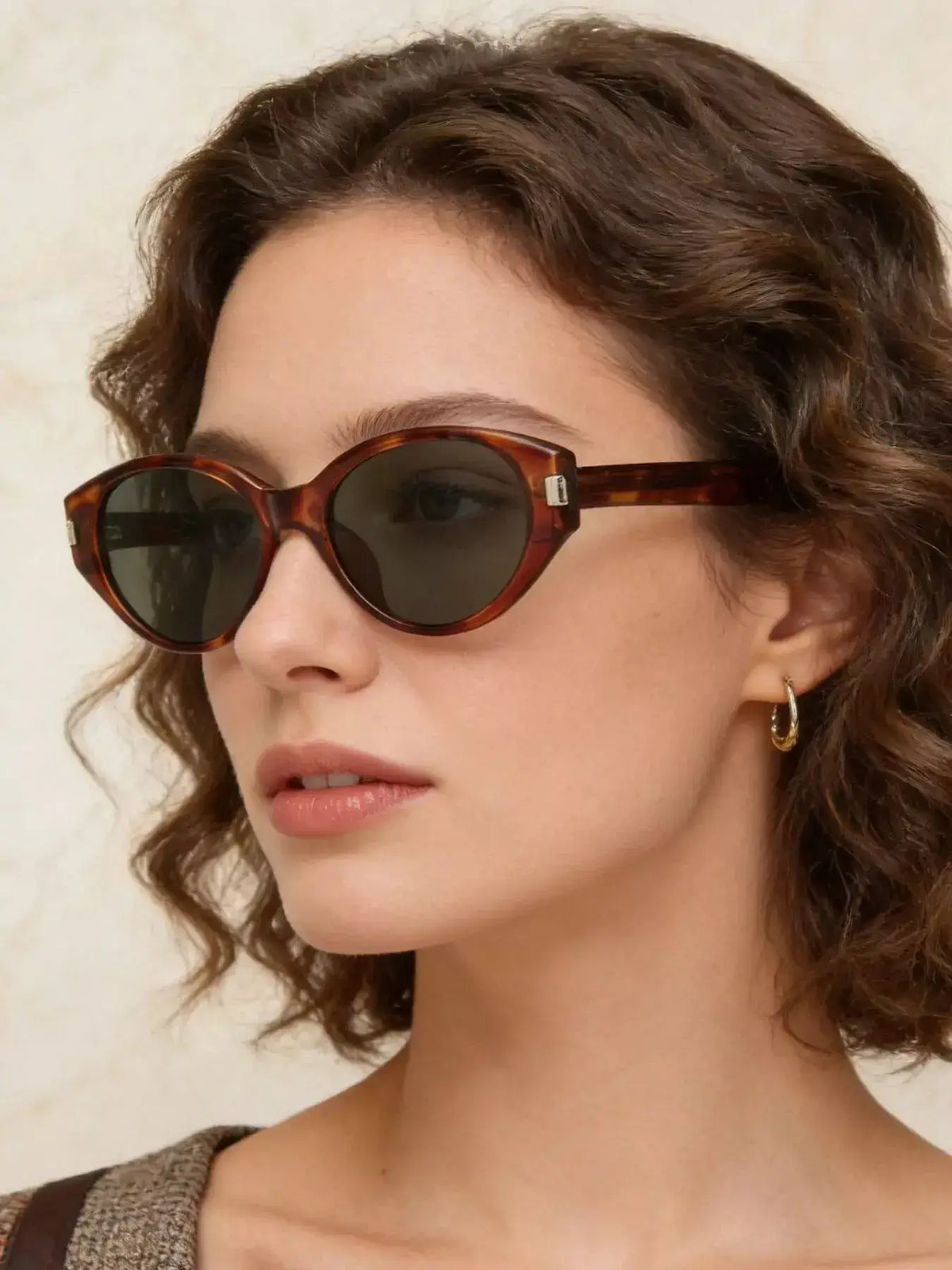 Lightweight Cat-Eye Sunglasses in brown frame, showcasing UV protection and stylish design.