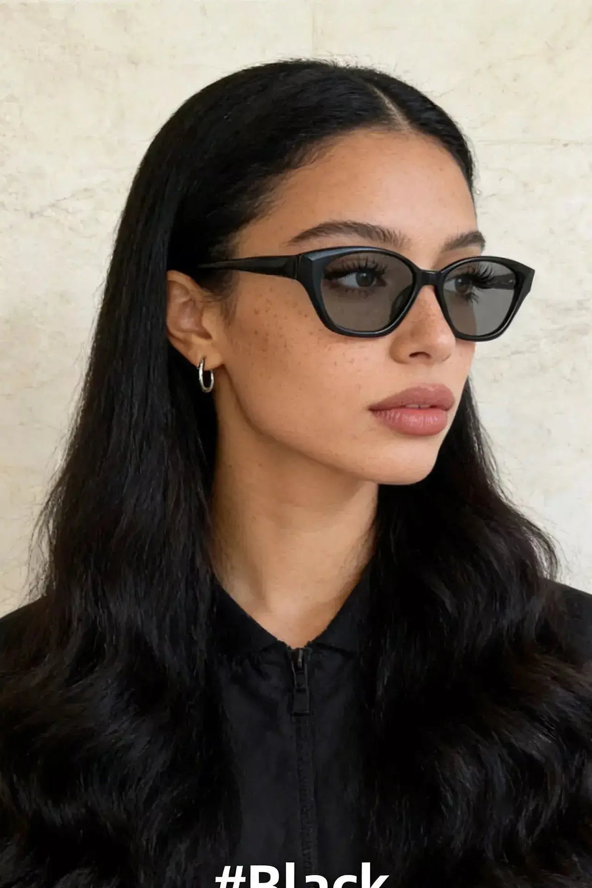 Stylish woman wearing UV Protection Sunglasses, showcasing UV protection and modern design.