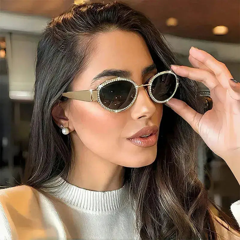 Rhinestones Decor Oval Sunglasses worn by a woman, showcasing UV400 protection and stylish metal frame.