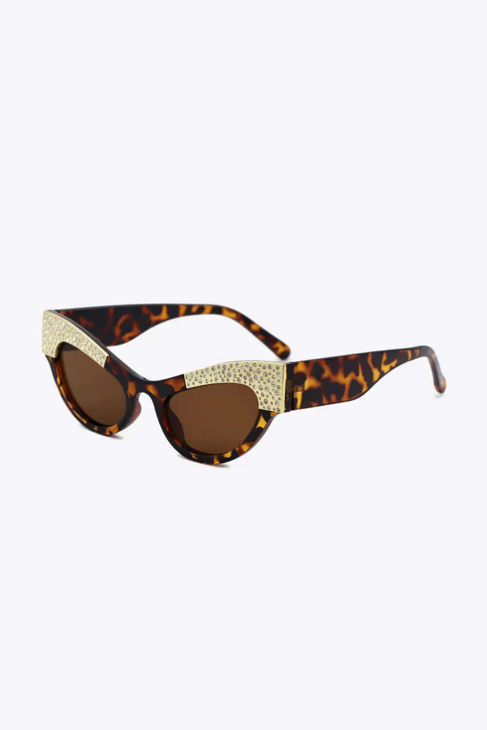 UV400 cat-eye sunglasses with rhinestone trim, leopard print frame, and brown lenses.